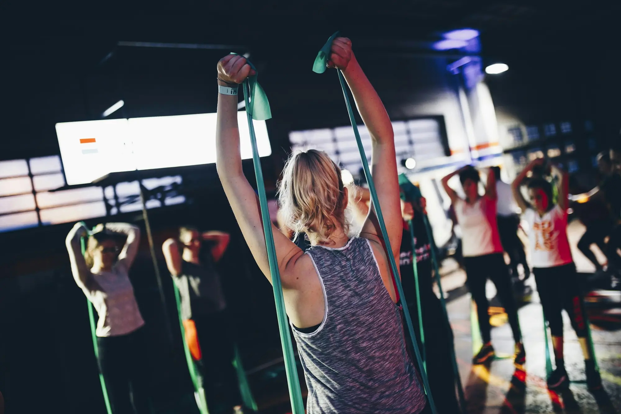 A group class training with resistance bands